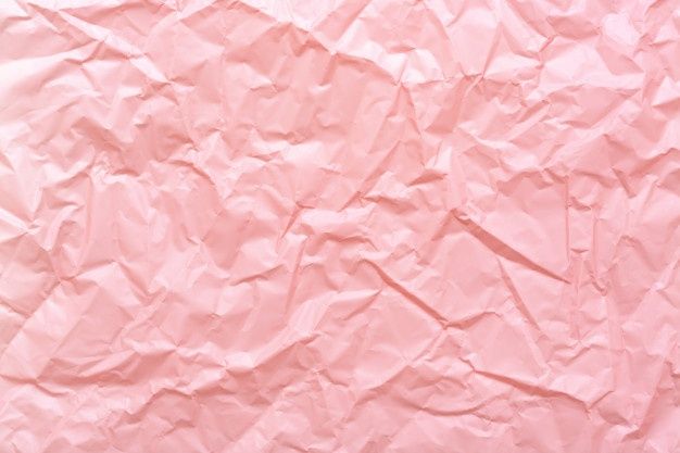 pink crumpled paper is shown in this image