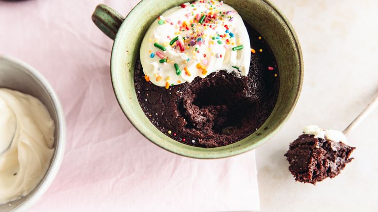 a cup filled with ice cream and chocolate cake