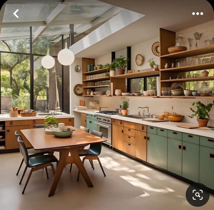 a kitchen filled with lots of wooden cabinets and counter top space next to a dining room table