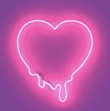 a heart shaped neon sign on a purple background