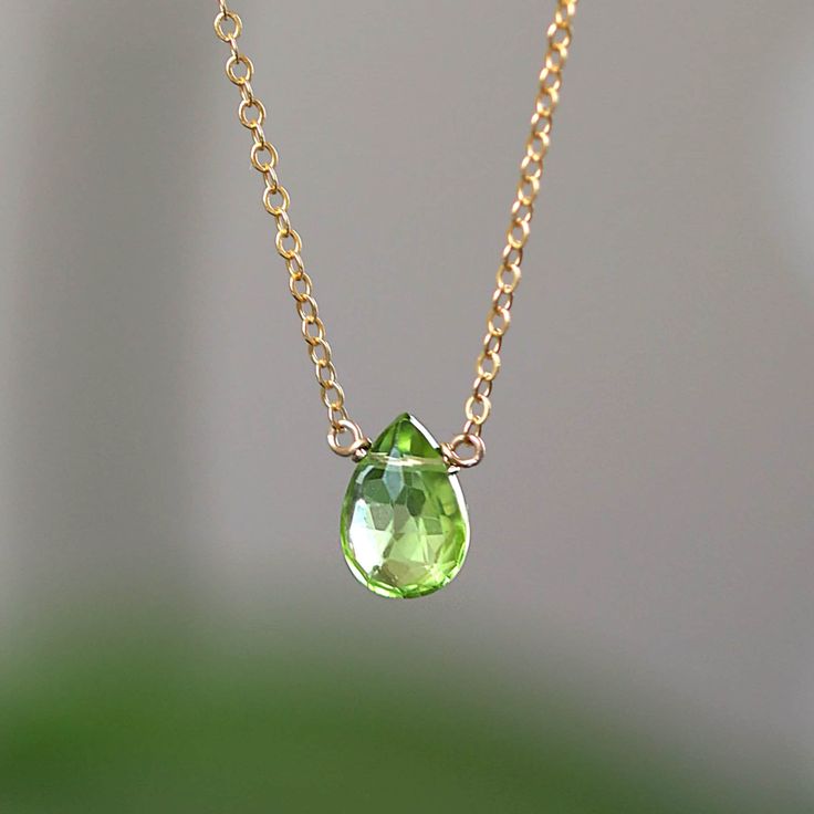 "Tiny lime green Peridot crystal has been seamlessly set to the delicate chain. Simple August Birthstone necklace for everyday wear and the perfect look. Our bestseller! Matching Threader Earrings: https://etsy.me/3kMSTMm Matching Studs: https://etsy.me/2lPXzVh Matching Dangel Earrings from the last photo: Coming Soon! M A T E R I A L S: * natural peridot * accented with tiny peridots at chain ends * metal of your choice: ✔ 14k Gold Filled ✔ 14k Rose Gold Filled ✔ Sterling Silver * 14k Solid Gol Green Birthstone Necklace With Delicate Chain For May, Green Birthstone Necklace For May With Delicate Chain, Lime Green Peridot Necklace For May Birthstone, Elegant Lime Green Necklace For Gift, Elegant Lime Green Necklace Gift, Faceted Peridot Necklaces As Gift, Faceted Peridot Necklaces For Gift, Gift Peridot Faceted Necklaces, Green Briolette Necklace For Gift