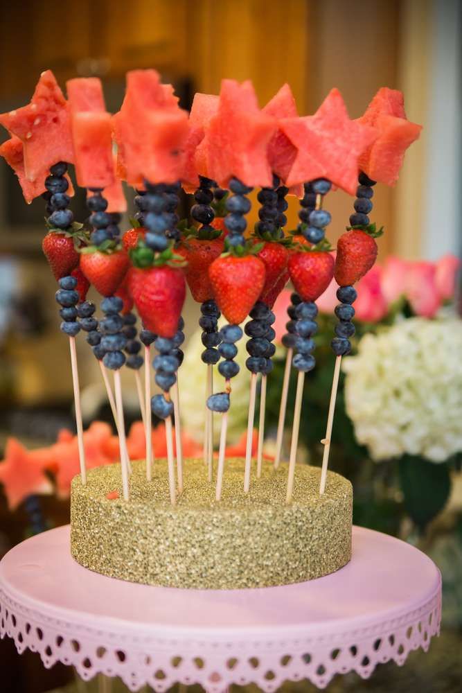 a cake with strawberries and blueberries on top is featured in the instagram