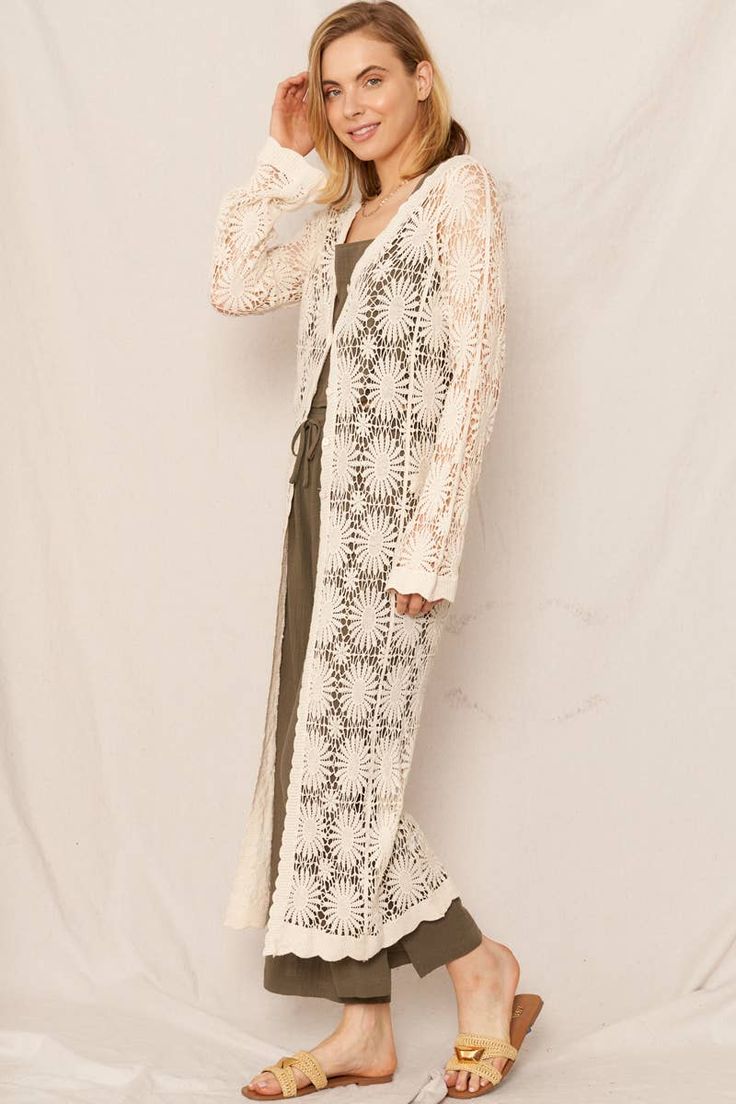 Look blooming beautiful in our Flower Pattern Crochet Kimono Cardigan! This maxi kimono boasts a delicate, floral pattern and is hand-crocheted for a unique touch. Perfect for adding a pop of style to any outfit. (Flower power never looked so good!) 100% Cotton Bohemian Cream Kimono For Spring, Cream Bohemian Kimono For Spring, Spring Beach Beige Cardigan, Crochet Outerwear For Beach In Spring, Spring Beach Outerwear With Crochet Details, Spring Bohemian Floral Print Cardigan, Bohemian Long Kimono For Brunch, Bohemian Beige Floral Print Outerwear, Cream Wrap Kimono For Spring