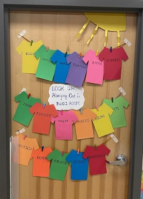 a bulletin board with colorful clothes on it