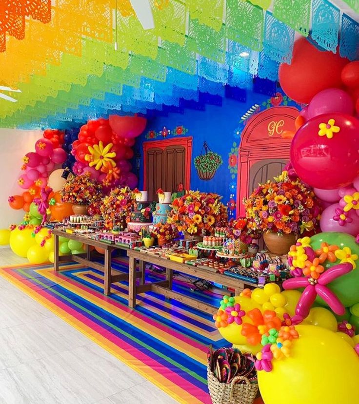 a colorful party with balloons and decorations