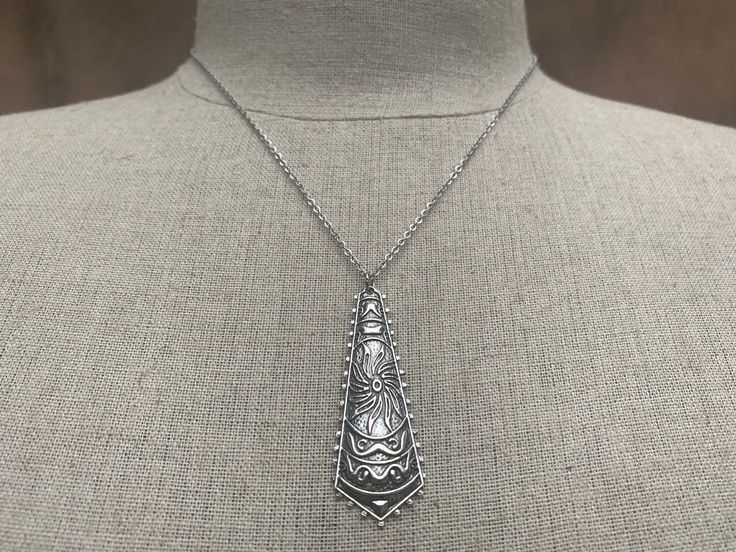 "Unique, funky and stylish boho pendant necklace. It has incredible detail and design. This is a very versatile piece and would be perfect for everyday wear. The pendant measures 2\" long by 3/4\" wide. Made from allergy free plated silver. It hangs from a shiny strong 18\" stainless steel necklace chain with a lobster clasp. I have matching earrings in my shop if you would like the whole set. Here is a direct link https://etsy.me/31dVEuN Thanks for stopping by! Please take a moment and visit th Bohemian Sterling Silver Long Necklace, Adjustable Large Pendant Necklace For Festivals, Bohemian Long Sterling Silver Necklace, Bohemian Sterling Silver Dangle Necklaces, Sterling Silver Necklace With Large Pendant For Festival, Bohemian Silver Necklace With Large Pendant, Silver Bohemian Necklace With Large Pendant, Bohemian Adjustable Soldered Necklaces, Artisan Sterling Silver Necklace For Festival