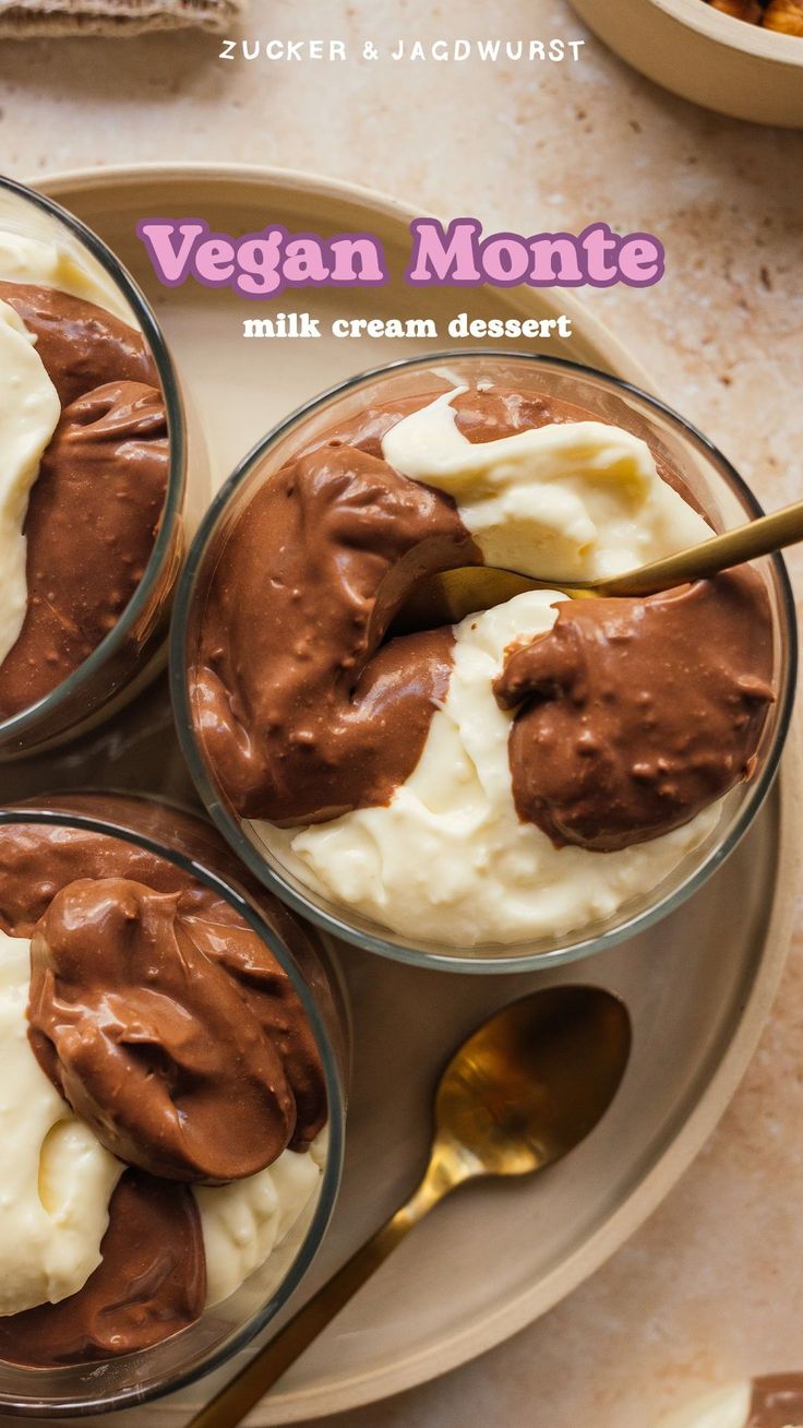 three desserts in glass bowls with spoons on a plate next to each other