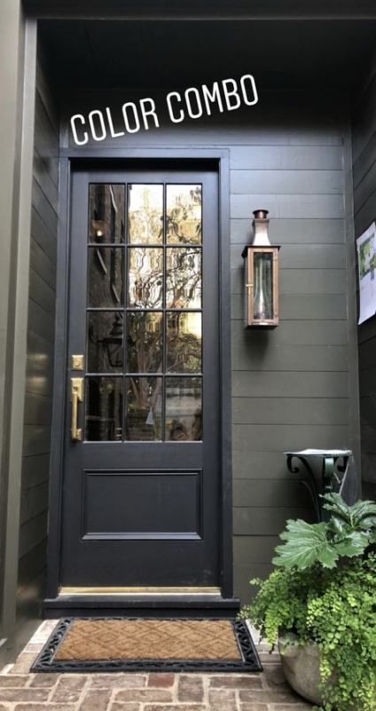 the front door of a gray house with black trim and glass windows that says color combo