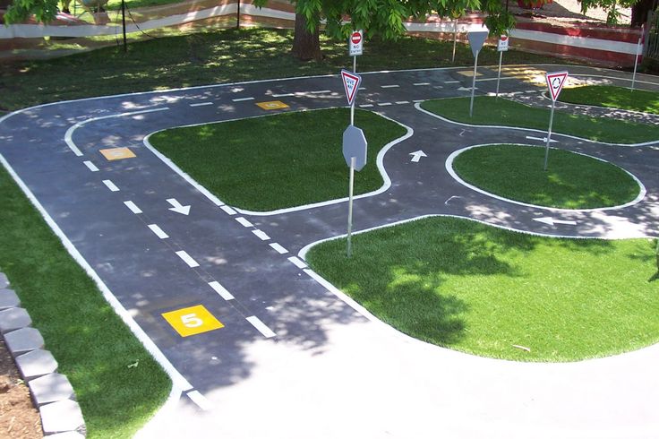 an aerial view of a roundabout in the middle of a park