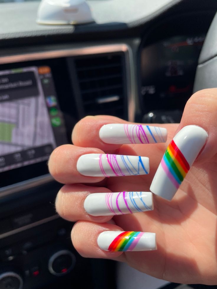 A hand showing nails, the thumb and pinky have a diagonal strip of rainbows and the middle three fingers are white with blue purple and pink lines going horizontally across the nails Pride Coffin Nails, Bi Pride Nails, Nails Coffin Square, Pride Nails, Flag Nails, Bi Flag, Long Acrylic Nails Coffin, Long Acrylic, Rainbow Nails