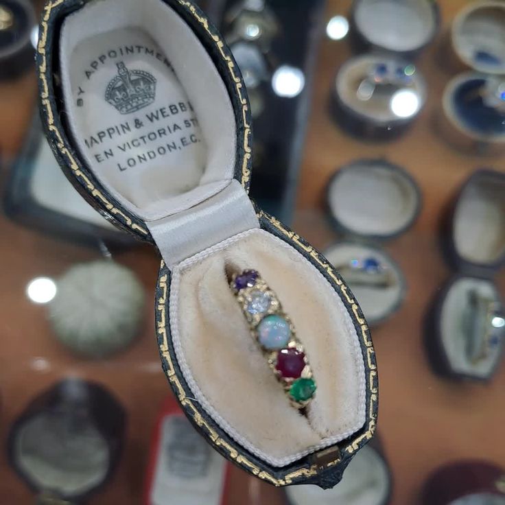 an open ring box sitting on top of a table