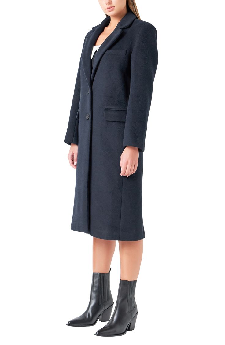 Feel the polish of this woolly longline coat designed in a tailored two-button fit. Front button closure Notched lapels Nonfunctional four-button cuffs Chest welt pockets; front flap pockets Back vent Lined 50% wool, 50% polyester Dry clean Imported Office Wool Coat With Notch Lapel And Double Button, Timeless Long Wool Coat For Work, Notch Lapel Pea Coat With Concealed Placket For Work, Workwear Pea Coat With Notch Lapel And Concealed Placket, Classic Wool Coat For Work With Button Cuffs, Classic Wool Coat With Button Cuffs For Work, Tailored Wool Coat With Button Cuffs For Office, Wool Coat With Lapel Collar For Work, Structured Pea Coat With Button Closure For Work