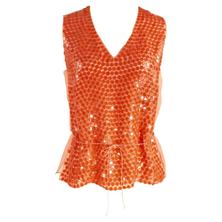 CHANEL Cruise 2000 Silk orange top On the front giant sequins , on the back organza silk, thin silk belt Size FR 42 Made in France 100% silk Flat measures: Length cm. 56 Shoulders cm. 35 Bust cm. 46 Waist line cm. 39 Top Naranja, Chanel Top, Embellished Shirt, Chanel Cruise, Fancy Tops, Orange Top, Belt Size, Made In France, Peplum Top