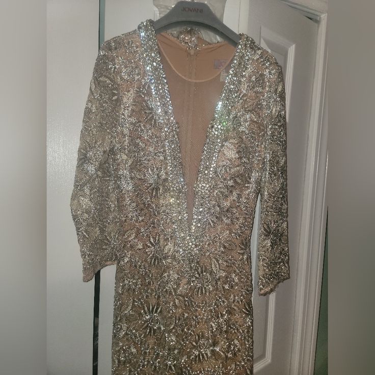 Brand New Jovani Dress. Size 6. Bought It For $800. Selling It For $550. Luxury Long Sleeve Sequin Dress For Formal Occasions, Luxury Champagne Evening Dress For Cocktail, Luxury Champagne Dress For Evening, Luxury Champagne Color Evening Dresses, Luxury Sequin Dress For Gala, Luxury Long Sleeve Holiday Dresses, Luxury Embellished Mini Dress For Formal Occasions, Embellished Luxury Mini Dress For Formal Occasions, Luxury Sequin Evening Dress