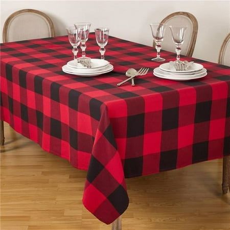 a red and black checkered table cloth with place settings