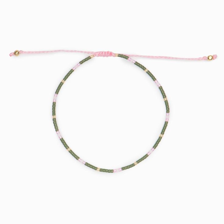 Single strand of delicate off-white thread Perfect for layering Adjustable sizing