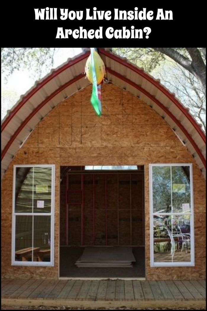 the inside of a building that is under construction with an open garage door and windows