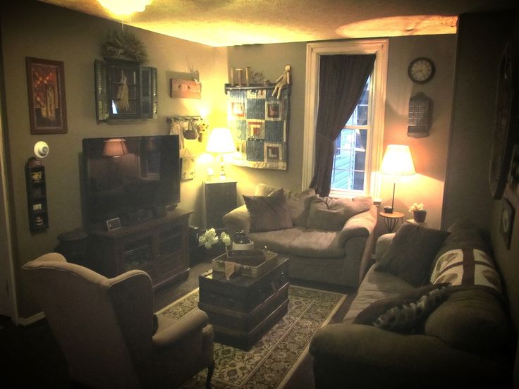 a living room filled with furniture and a flat screen tv