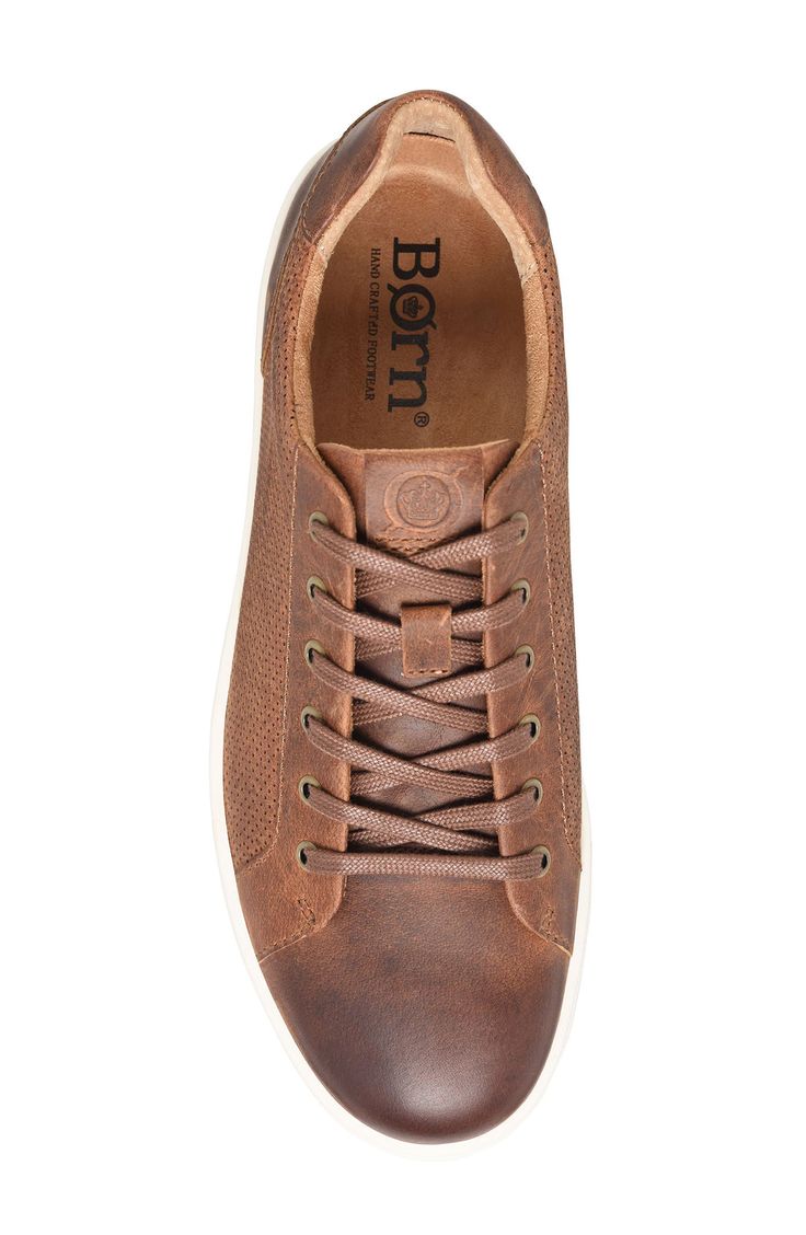 Perforated full-grain leather lends instant old-favorite status and an elevated look to a versatile sneaker featuring a cushy, arch-supporting footbed. Leather upper/textile lining/synthetic sole Imported Comfortable Brown Sneakers With Ortholite Insole, Brown Slip-on Sneakers With Leather Footbed, Classic Brown Sneakers With Perforations, Comfortable Walking Sneakers With Leather Footbed, Sporty Sneakers With Leather Footbed For Walking, Brown Sneakers With Leather Footbed, Leather Sneakers With Ortholite Insole, Comfortable Leather Sneakers With Ortholite Insole, Comfortable Plain Toe Sneakers With Leather Footbed