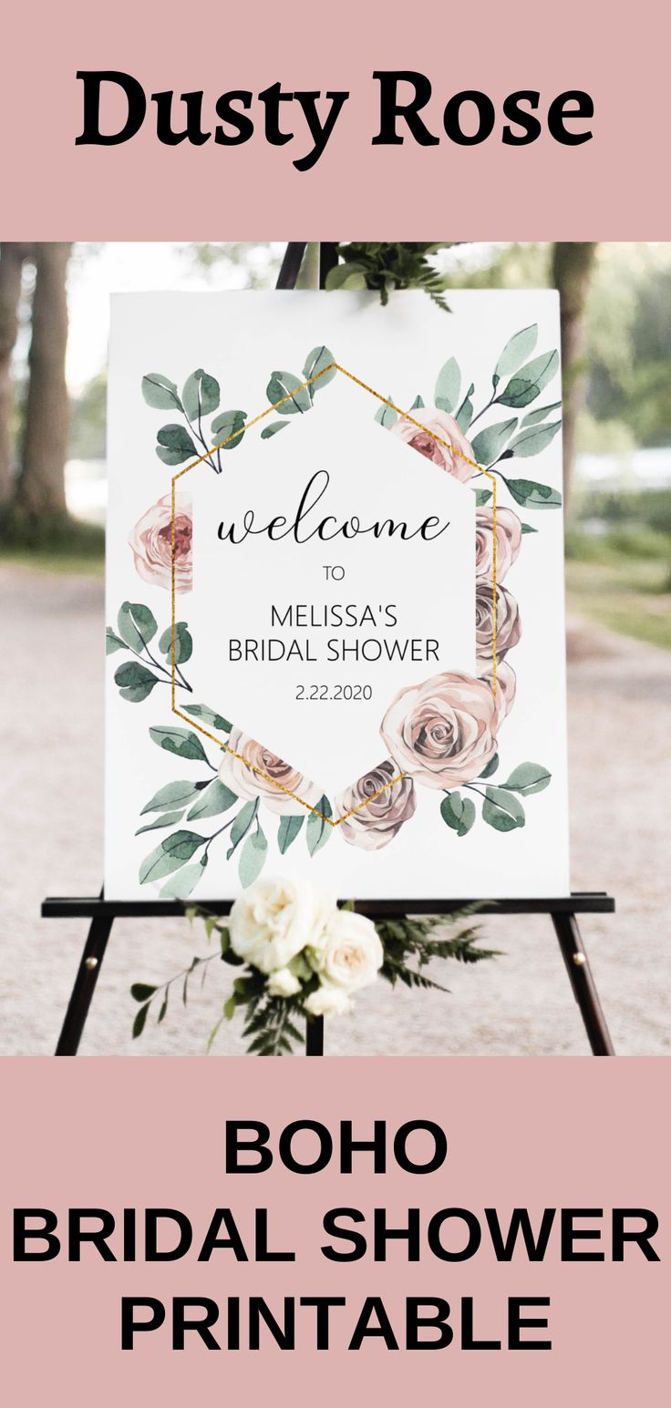 a welcome sign with flowers and greenery for a bridal shower