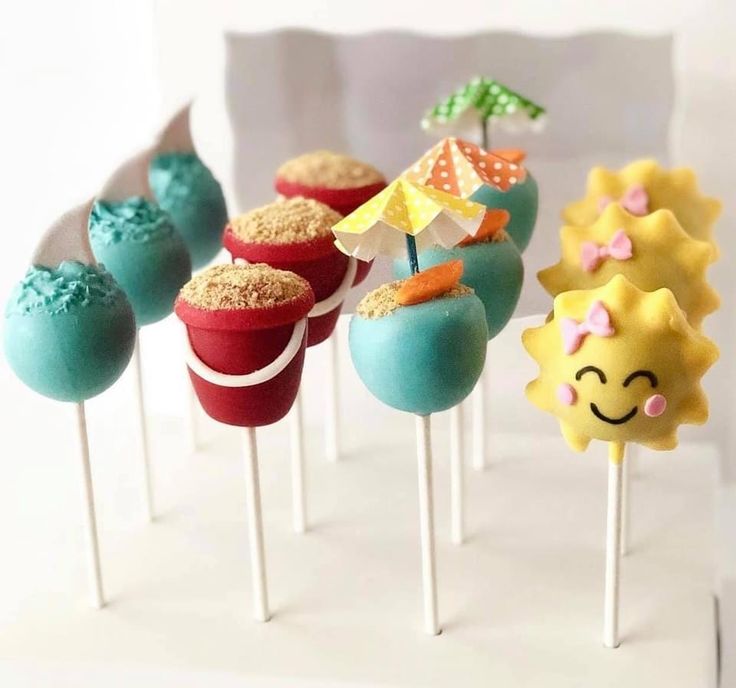 there are many cake pops with different designs on them