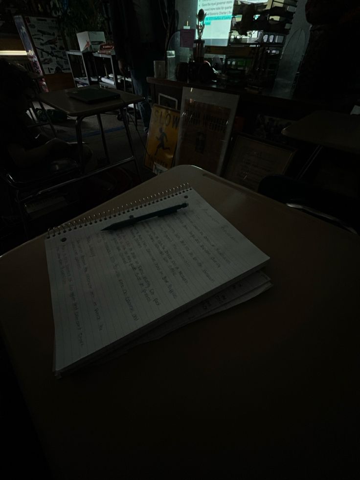 an open notebook sitting on top of a table