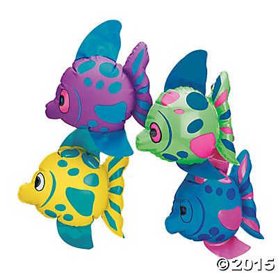 three colorful fish shaped balloons floating in the air