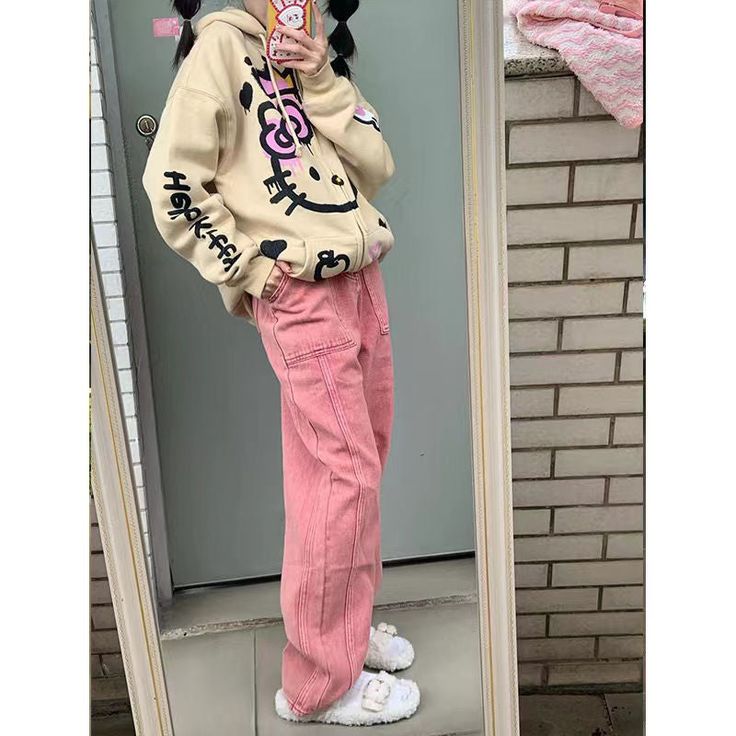 This hoodie features a the iconic Hello Kitty print and perfect for everyday wear. Trendy Pink Hoodie With Pockets, Casual Pink Hoodie With Cartoon Print, Cotton Hoodie With Cartoon Print For Spring, Spring Cotton Hoodie With Cartoon Print, Casual Hooded Hoodie With Cat Print, Casual Hooded Hello Kitty Sweatshirt, Casual Hello Kitty Hooded Sweatshirt, Long Sleeve Cotton Hoodie With Cat Print, Casual Hooded Sweatshirt With Hello Kitty Print