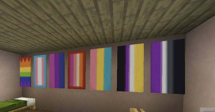 an empty room with colorful paintings on the wall