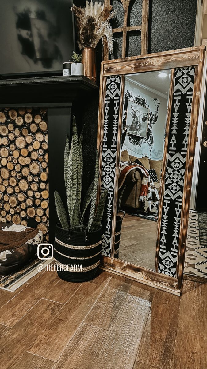 Western moody boho black wall snake plant Pendleton mirror Aztec rug Western Full Length Mirror, Diy Western Mirror Frame, Western Mirror Ideas, Western Vanity Ideas, Brass Bunkhouse, Barndominium Bedroom, Rustic Western Wall Decor, Boho Home Ideas, Western Mirrors