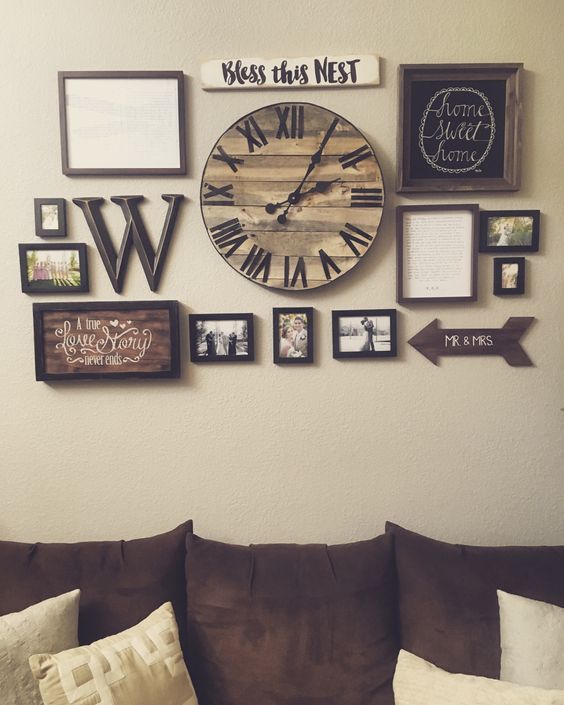 a living room filled with lots of pictures and a large clock mounted to the wall