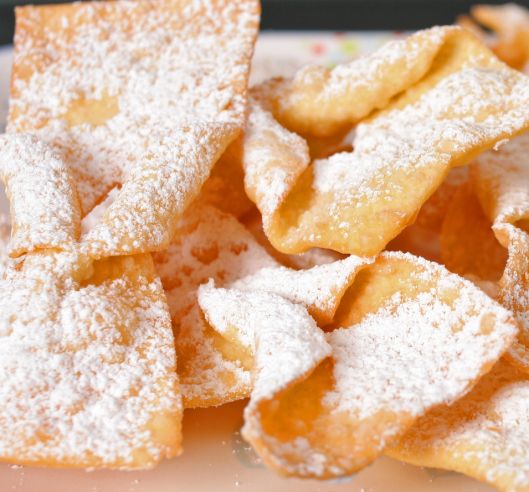 powdered sugar on top of small pieces of food