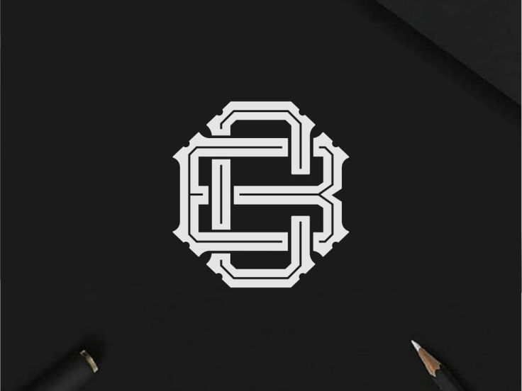 a black and white logo with the letter s in it's center, surrounded by two pencils