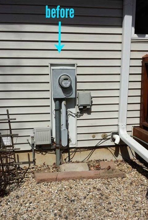 an old fashioned air conditioner sitting in front of a house