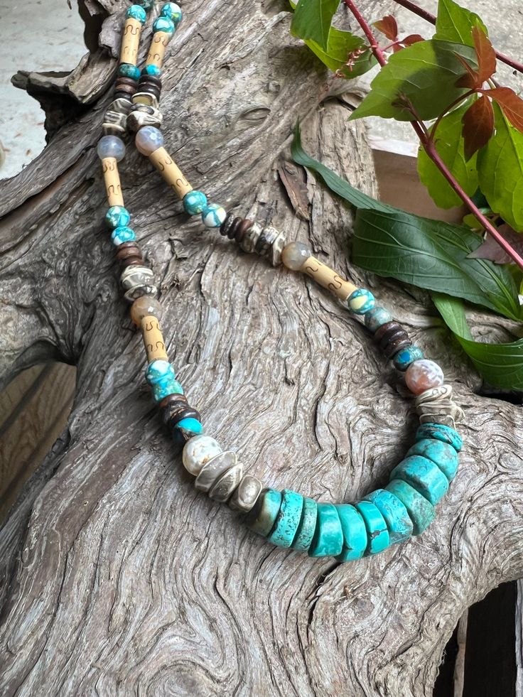 Beautiful Turquoise, Sea Sediment Jasper and Bone Necklace  This beaded necklace has an assortment of beads including turquoise, bone, sea sediment jasper gemstone beads running throughout  Necklace is chest length & measures approximately 20" This item is one of kind and will not be duplicated Unique Hand-strung Turquoise Beaded Necklace, Rustic Turquoise Jewelry For The Beach, Rustic Blue Beaded Necklaces, Rustic Blue Beaded Necklace, Turquoise Beaded Necklaces With Natural Stones For Beach, Artisan Turquoise Beaded Necklace For Beach, Bohemian Chrysocolla Beaded Necklaces For Jewelry Making, Bohemian Chrysocolla Round Bead Necklace, Rustic Turquoise Necklaces With Natural Stones