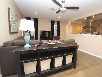 a living room with couches and a table in it