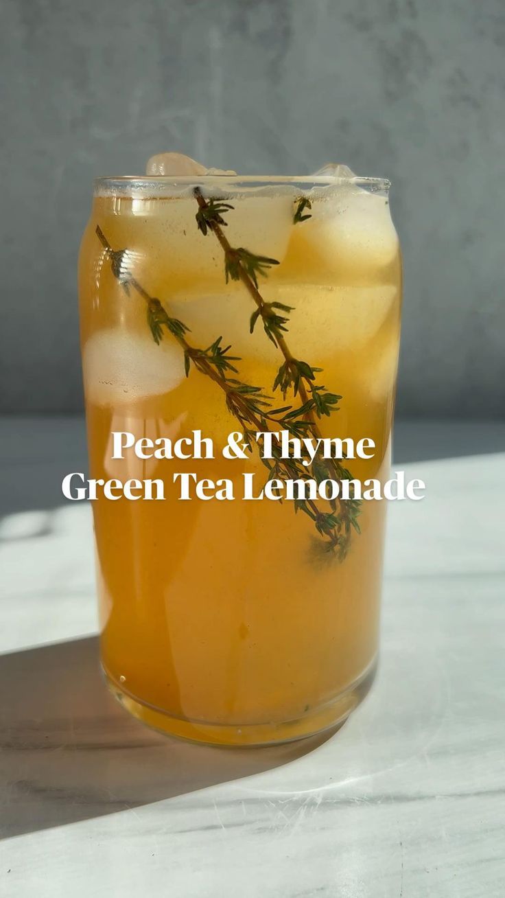 a glass filled with green tea and lemonade