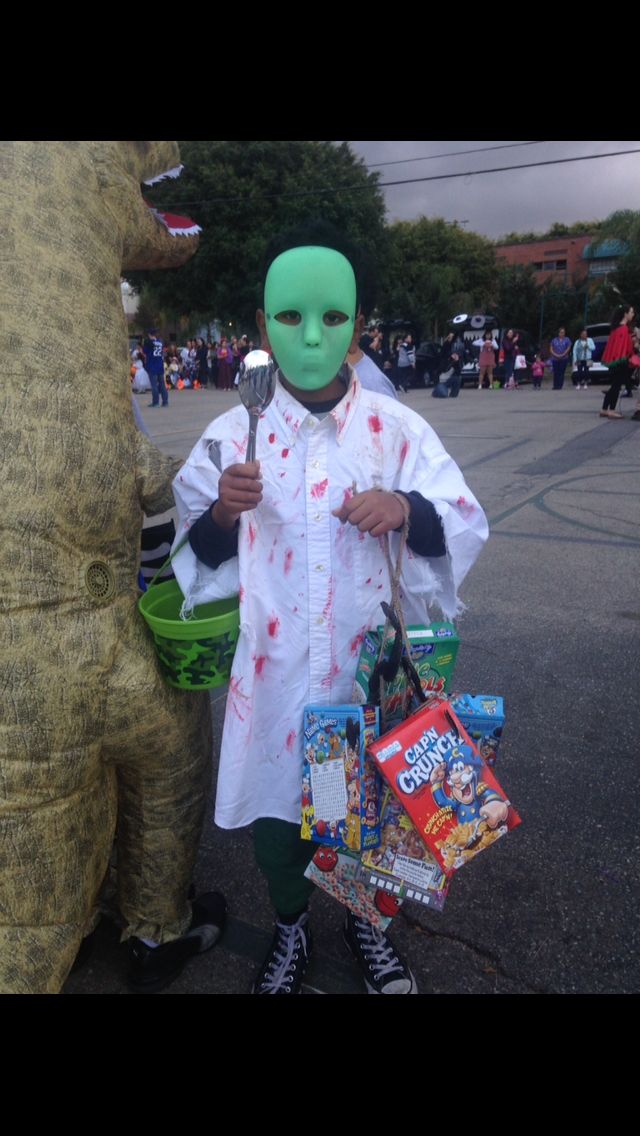 a person in a costume standing next to an animal