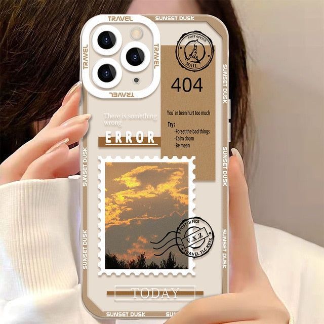 a woman holding up an iphone case with stamps on it