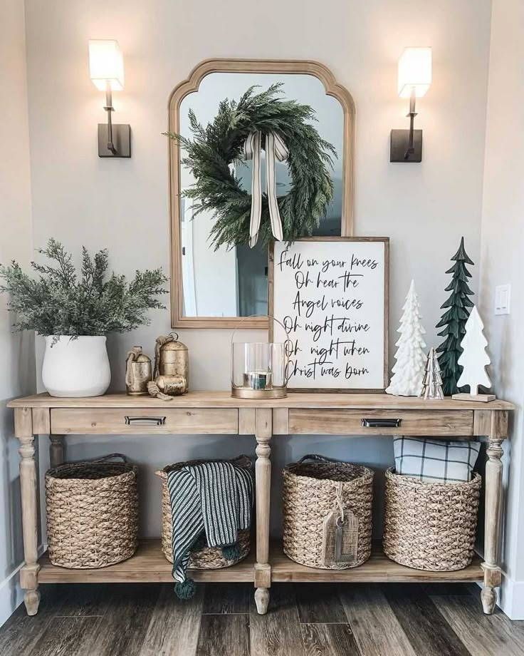 the entryway is decorated for christmas with wreaths and baskets