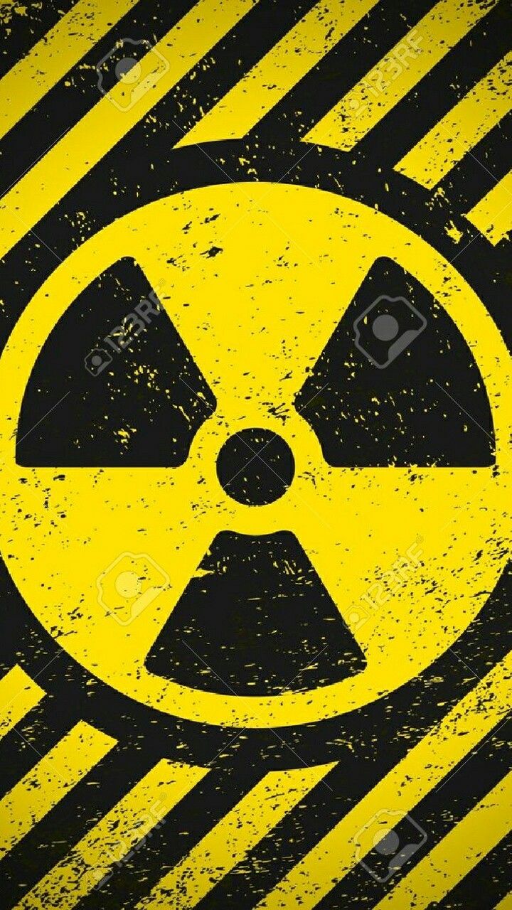 an image of a radioactive sign on a black and yellow striped background stock photo - 717