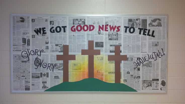 a bulletin board with newspaper and crosses on it