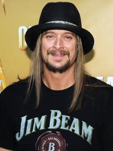 a man with long hair wearing a black hat