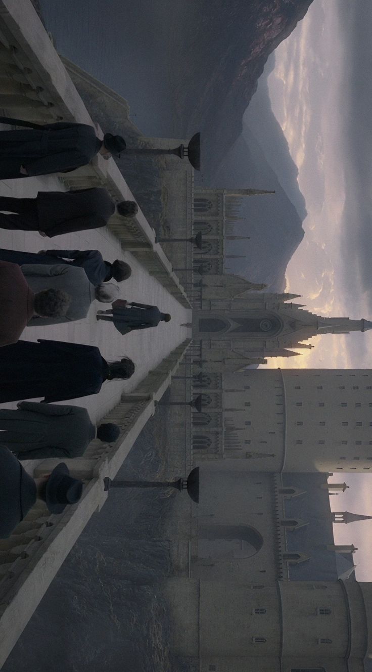 an image of people standing in front of a building that looks like it is reflecting the sky