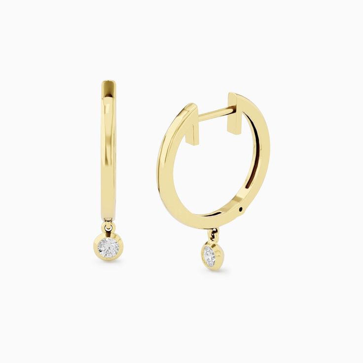 Earrings Specifications for the pair: Gold: Made in 14k Solid Gold or 18k Solid Gold Hoop Inner Diameter: 10 mm Diamond Carat: 0.07 carats Diamond Color: G Diamond Clarity: VS ''''''''''''''''''''''''''''''''''''''''''''''''''''''''''''  Remember to favorite the bracelet, so it stays in your list  Design Time: It takes me 7-10 to finish the complete earrings and prepare it to ship. If you have any additional request, you can contact me and I will try to see what can be done. Shipping:  The earri Gold Round Cut Huggie Earrings, Yellow Gold Huggie Cartilage Earrings With Ear Wire, Small Hoop Earrings With Prong Setting, Gold Hoop Diamond Earrings With Ear Wire, Small Hoop Huggie Earrings With Prong Setting As Gift, Single Yellow Gold Huggie Diamond Earring, Yellow Gold Small Hoop Cartilage Earrings, Minimalist Gold Hoop Diamond Earrings, Gold Round Cut Huggie Earrings As Gift