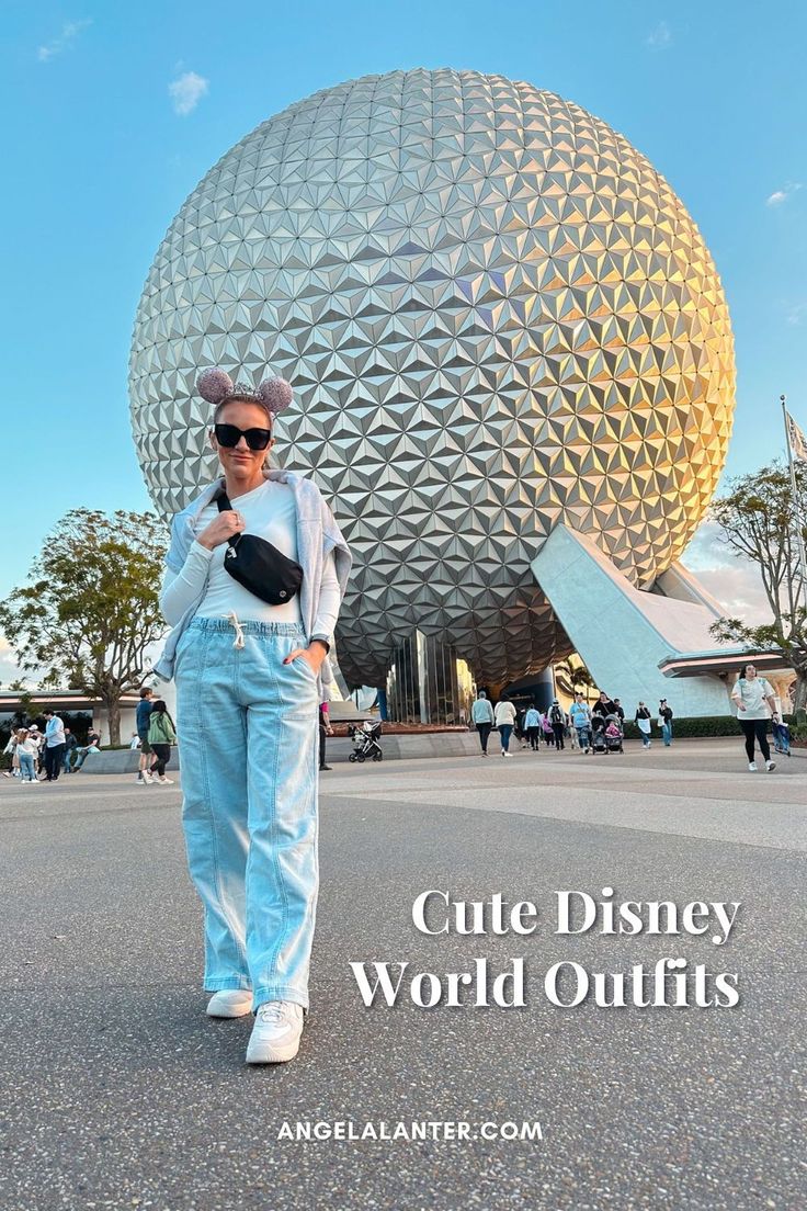 a woman standing in front of a large ball with the words cute disney world outfits