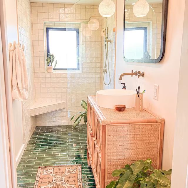 a bathroom with a sink, mirror and rug in it