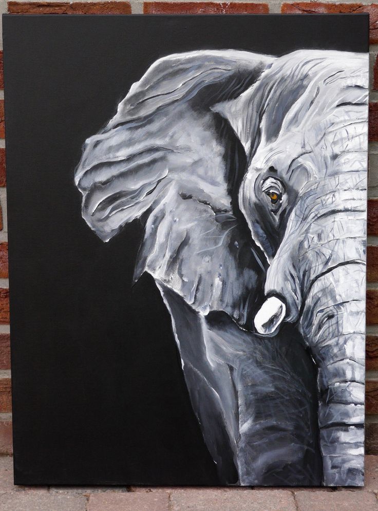 an elephant is painted on a black and white background with brick wall in the background