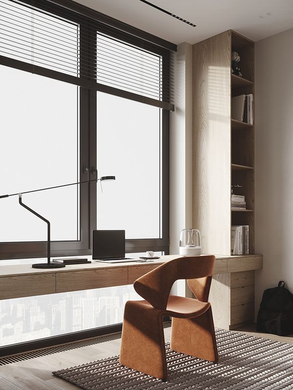 a chair sitting on top of a rug in front of a window next to a book shelf