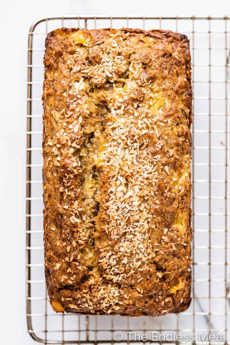 a loaf of bread sitting on top of a cooling rack